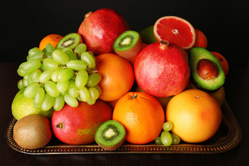 Fototapeta na wymiar Assortment of fruits on table, close-up