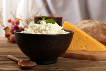 Tasty dairy products with bread on table close up