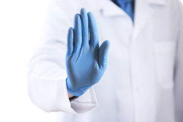 Doctor hand in sterile gloves isolated on white