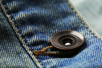 Metal button on clothes close up