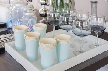 row of paper cups and glass