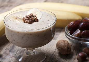 Smoothie with a banana with dates and nuts  .
