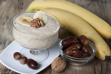 Smoothie with a banana with dates and nuts  .