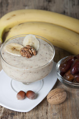 Smoothie with a banana with dates and nuts  .