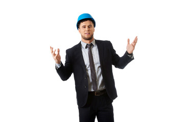 Businessman in hard hat holding copyspace.