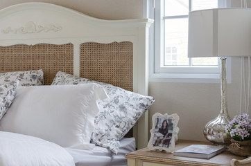white pillows on wooden bed in bedroom