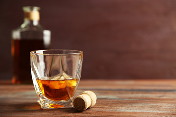 Whiskey on wooden background