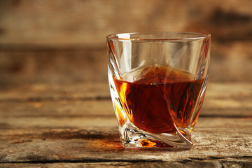 Whiskey on wooden background
