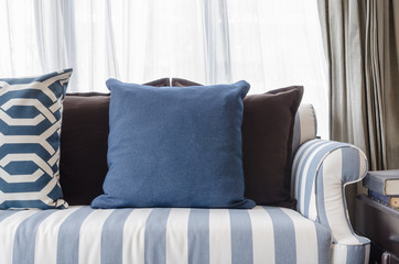 blue pillows on sofa in living room