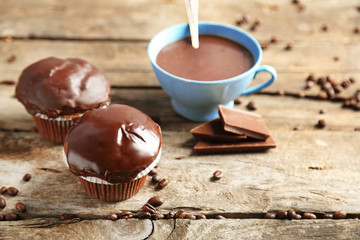 Tasty homemade chocolate muffins and cup of coffee