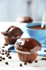 Tasty homemade chocolate muffins and cup of coffee