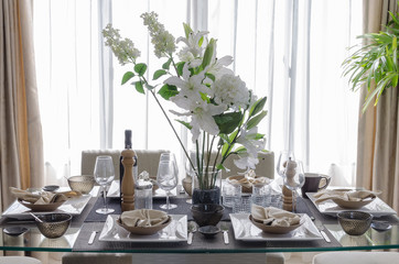 white modern dinning room with flower on table