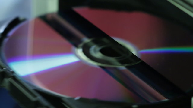 Close up view of CD - DVD in and out of the computer