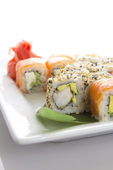 Seafood Maki sushi in white plate isolated on white background