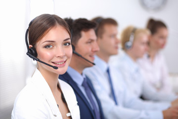 Attractive positive young businesspeople and colleagues in a