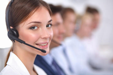 Attractive positive young businesspeople and colleagues in a