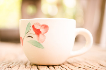coffee cup on wooden board