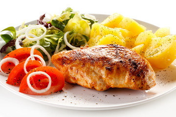 Fried chicken fillet, boiled potatoes and vegetable salad