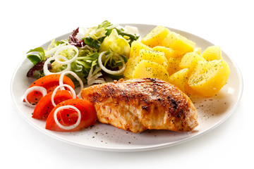 Fried chicken fillet, boiled potatoes and vegetable salad