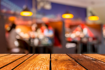  wood  table and  Coffee shop blur background with bokeh image