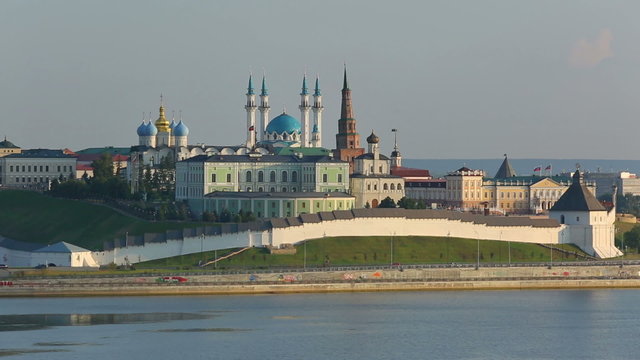 kazan kremlin with reflection in river at sunset - russia
