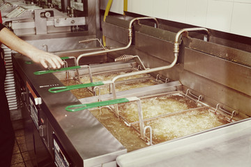 Deep fryers with boiling oil, toned image