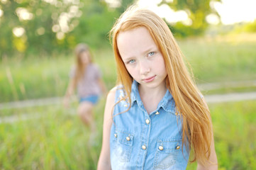 portrait of little girl outdoors in summer