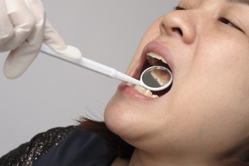 Woman has checking toot and mouth