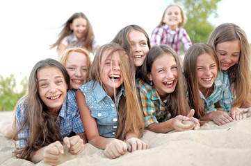 Fototapeta premium Portrait of joyful beautiful girlfriends on the nature