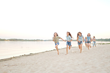 Portrait of joyful beautiful girlfriends on the nature