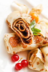 pancakes with chocolate and berries