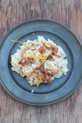 Risotto with chanterelle on a tin plate.