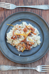 Risotto with chanterelle on a tin plate.