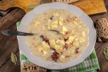 Sour soup with bread.