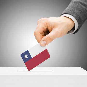 Voting concept - Male inserting flag into ballot box - Chile
