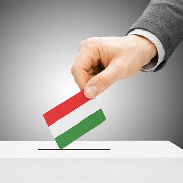 Voting concept - Male inserting flag into ballot box - Hungary
