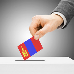 Voting concept - Male inserting flag into ballot box - Mongolia