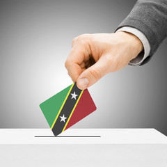Voting concept - Male inserting flag into ballot box - Saint Kit