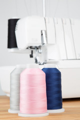 Sewing threads on wooden table