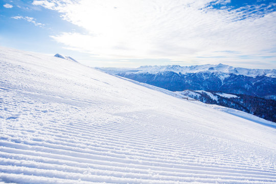 Winter landscape of ski-track and Caucasus hills