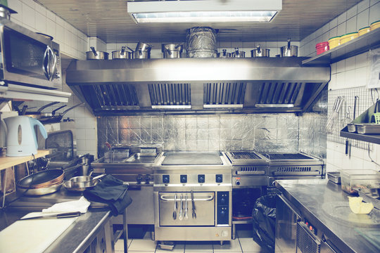 Typical kitchen of a restaurant, toned