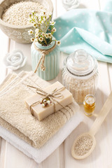 Obraz na płótnie Canvas Spa set: bar of natural handmade soap, sea salts, bath oil