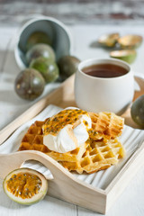 Waffles with cream and passionfruit