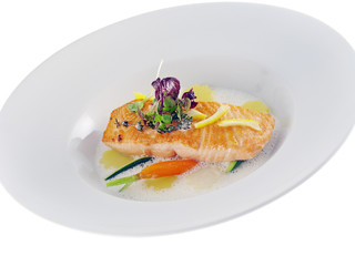 fried salmon with vegetables in frothy lemon sauce