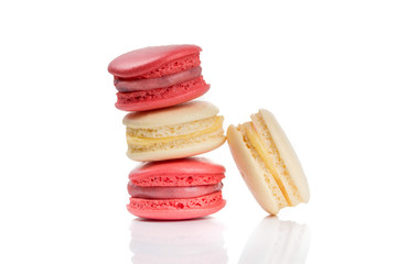 Stacke of red and beige macaroons isolated on white background