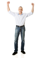Fototapeta premium Cheerful man with hands up