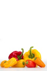Colourful peppers white background