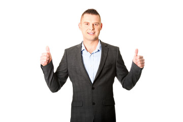 Young businessman gesturing ok sign