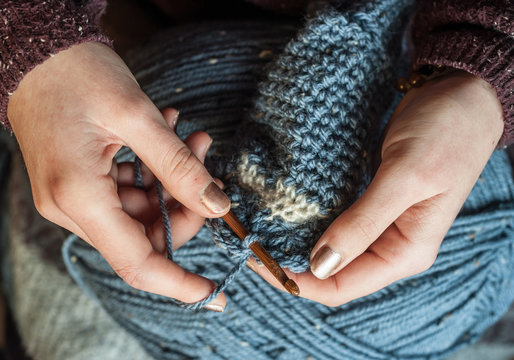 Close Up Of Hands Crocheting