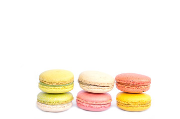 Colorful macarons on white background